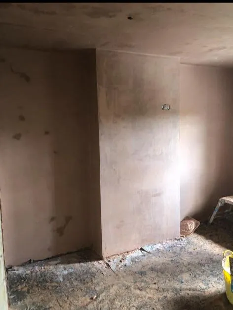 Fresh plaster on interior chimney breast