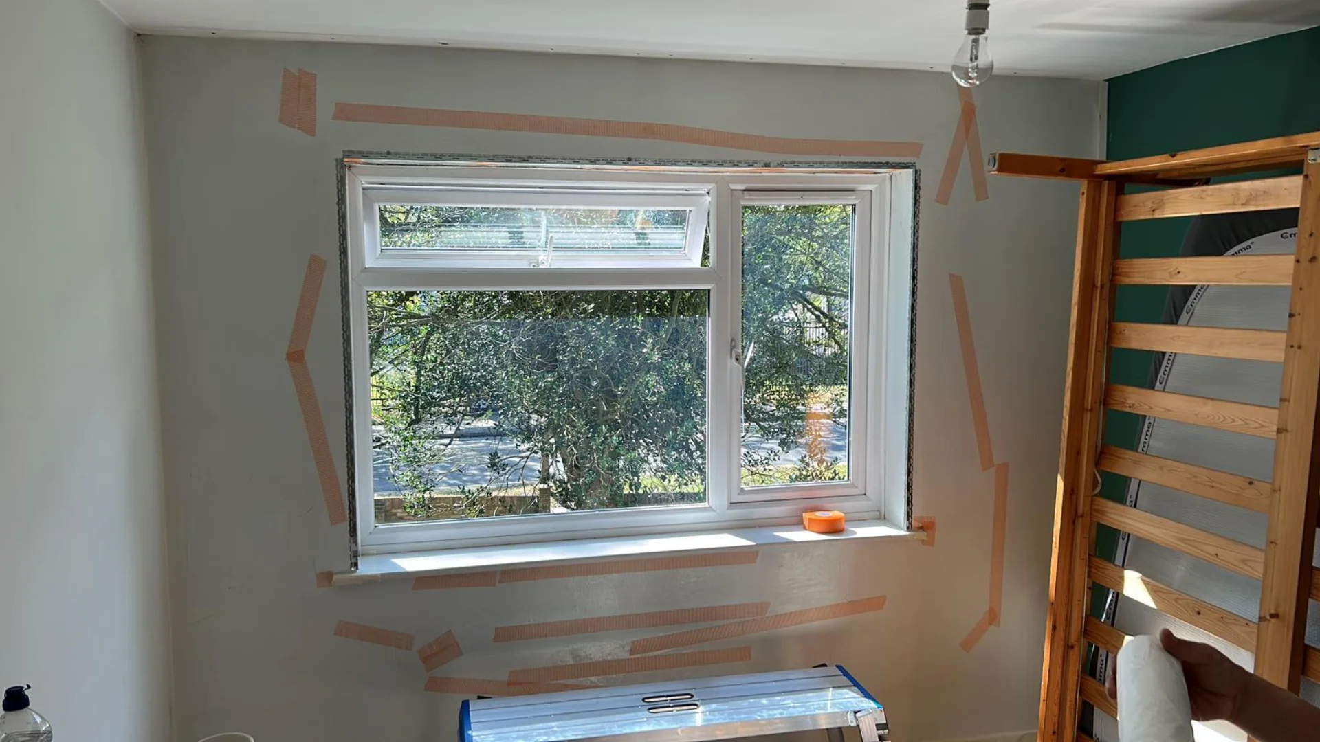 Prepared room for decoration with taped window